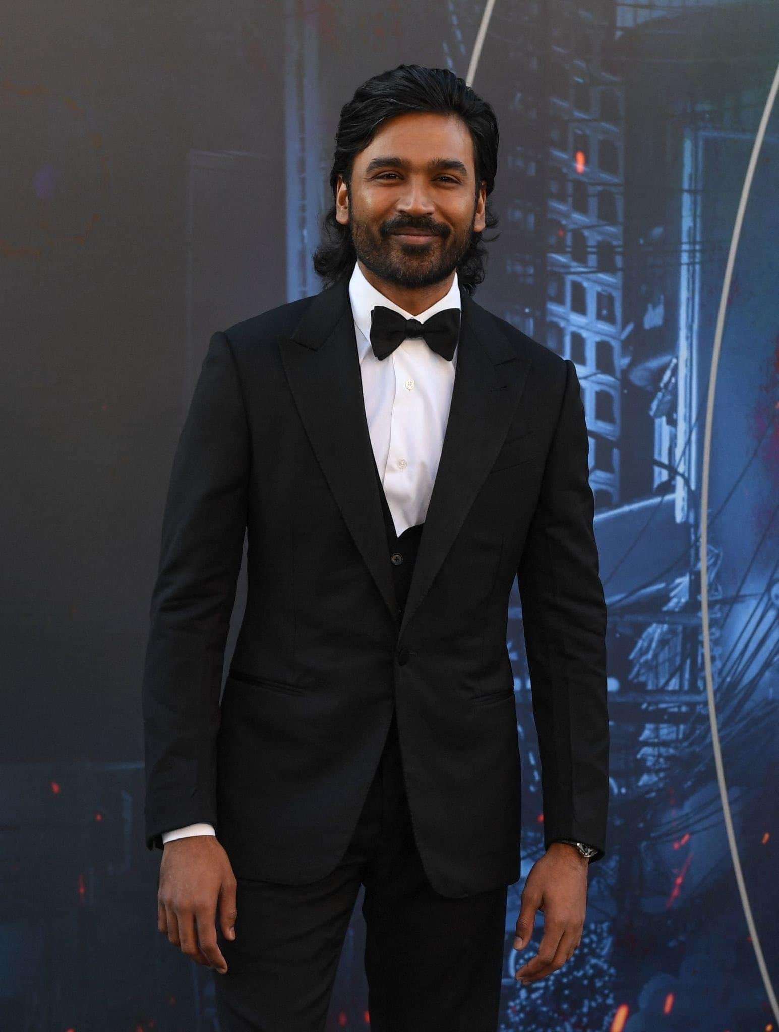 Dhanush attends The Gray Man premiere with sons Linga, Yathra. See